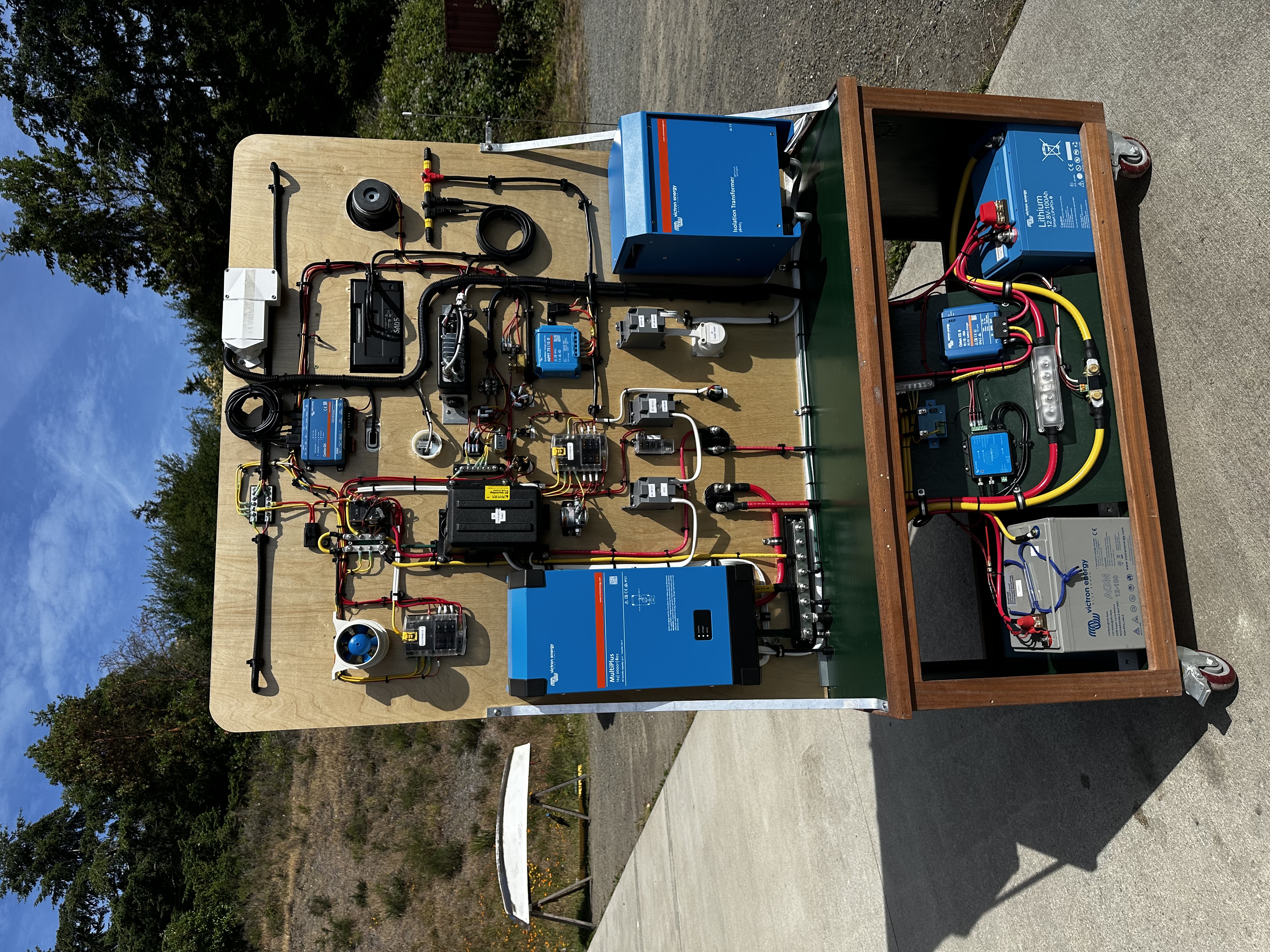 Full view of Board 2 capstone project outdoors showing complete integrated marine electrical system