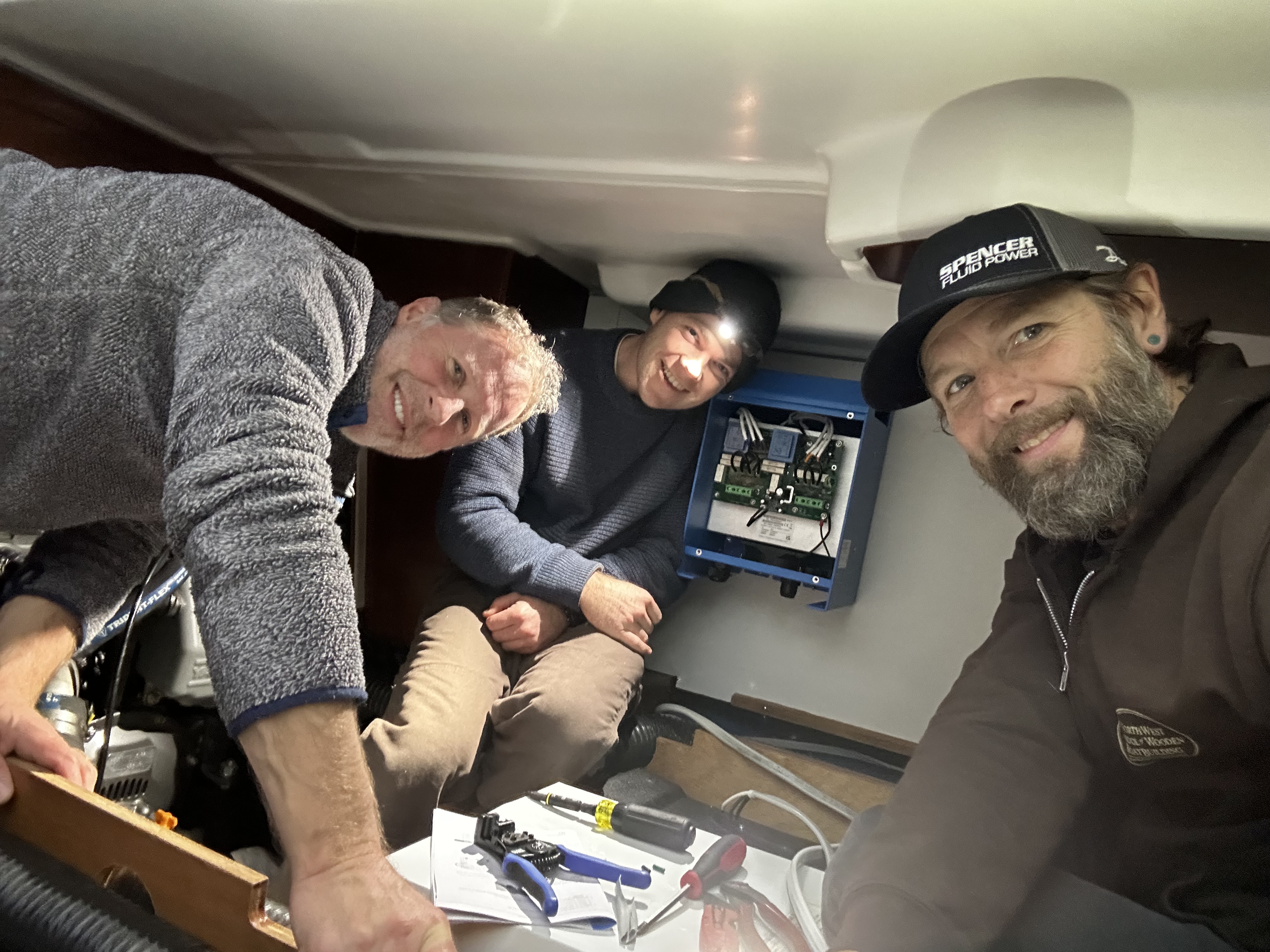 Team installing Victron isolation transformer in stern cabin